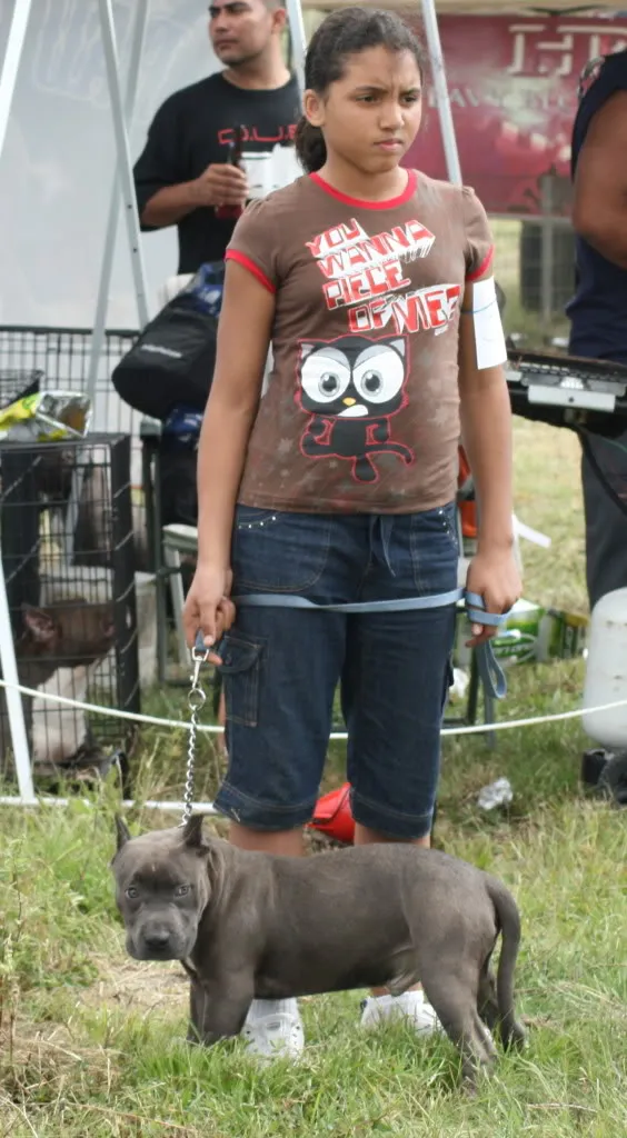 Dusty as a child with a dog at a show